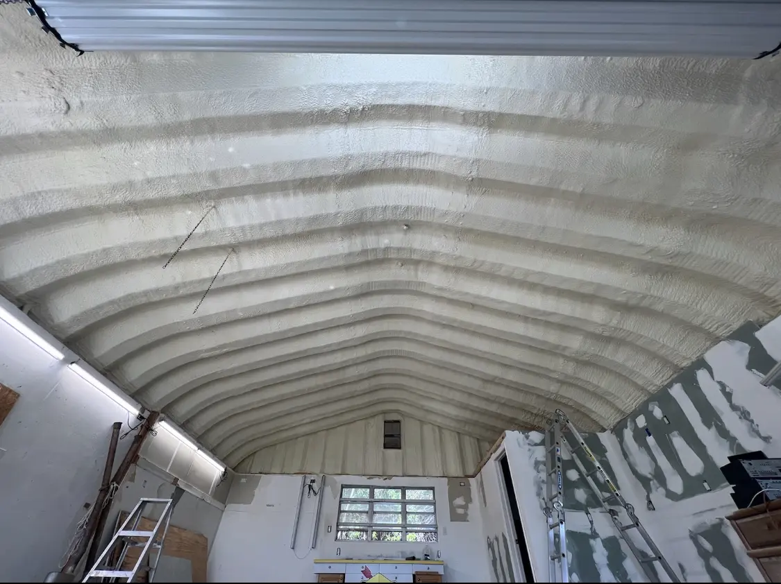 Spray polyurethane foam applied to the underside of a metal roof deck in Merrydale
